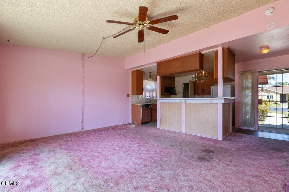 1931 Ukiah Street Oxnard, CA 93035 - Photo 5 of 21 an empty room with windows and a kitchen