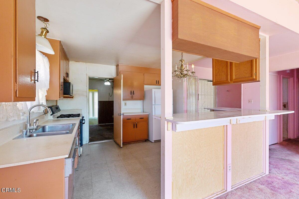 1931 Ukiah Street Oxnard, CA 93035 - Photo 7 of 21 a bathroom with a tub sink and mirror