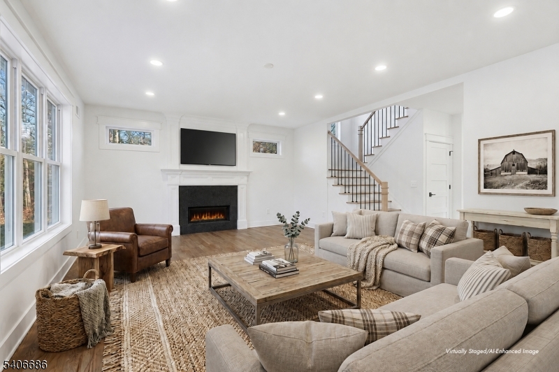 759 Mechlin Corner Road Hampton, NJ 08827 - Photo 9 of 45 a living room with furniture fireplace and a flat screen tv