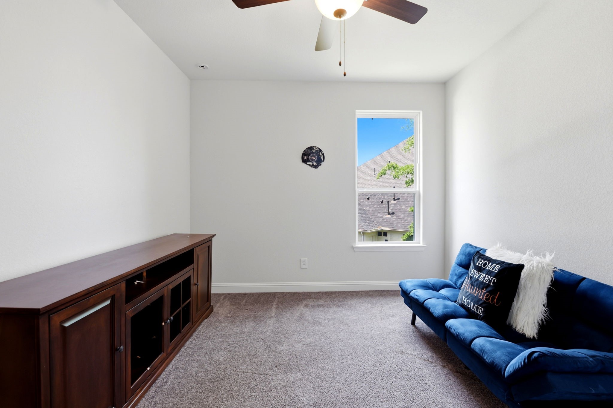 10062 South Goshawk Trail Conroe, TX 77385 - Photo 33 of 43 a living room with furniture and a window