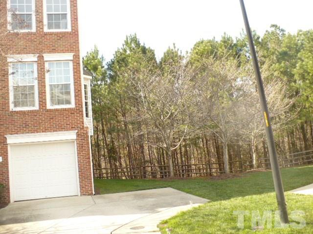 5402 Echo Ridge Road Raleigh, NC 27612 - Photo 3 of 4 a view of a backyard with large trees