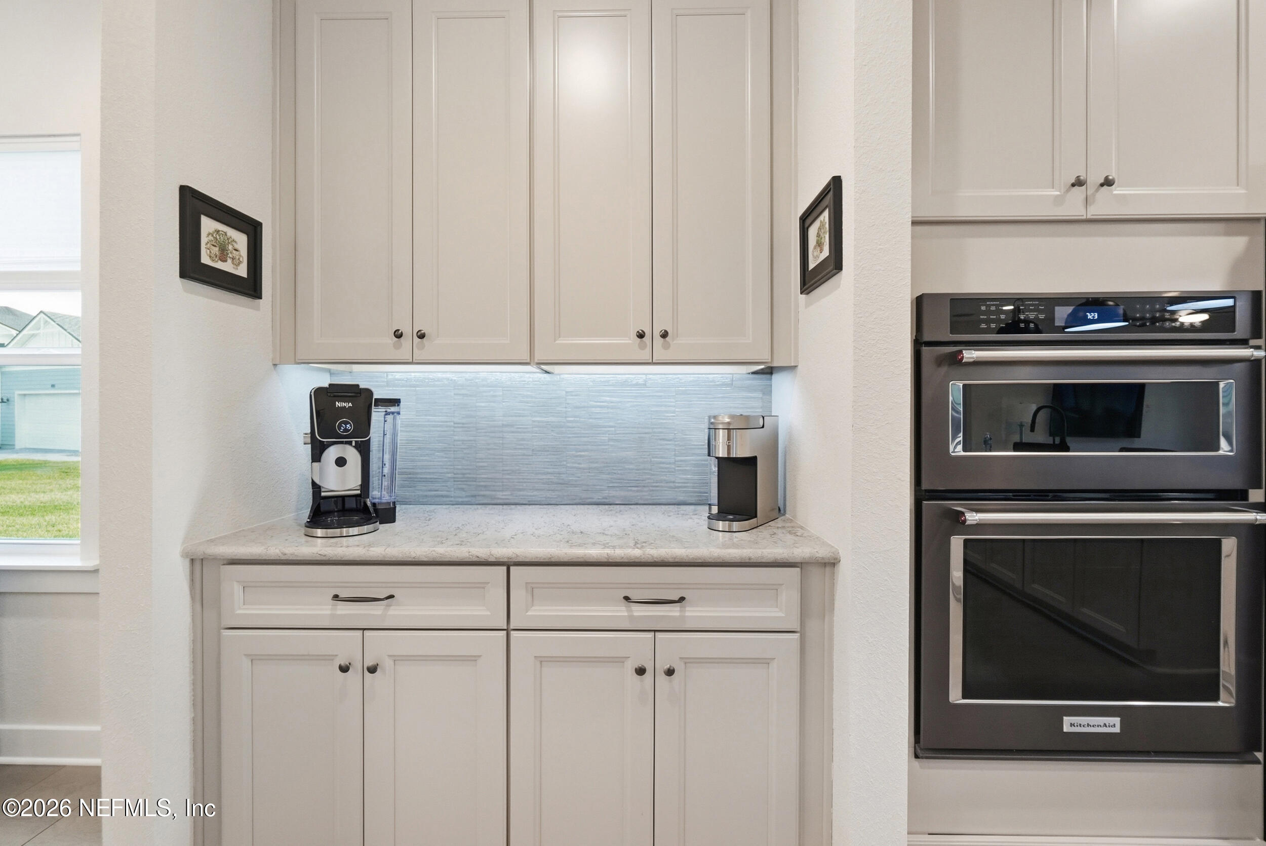 34 Red Rock Lane St. Johns, FL 32259 - Photo 16 of 71 a kitchen with granite countertop white cabinets and stainless steel appliances