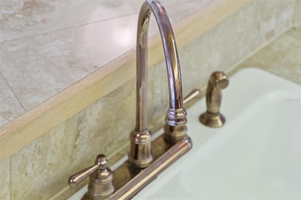 4621 South Atlantic Avenue, Unit 7506 Ponce Inlet, FL 32127 - Photo 16 of 46 a close view of a sink and tap