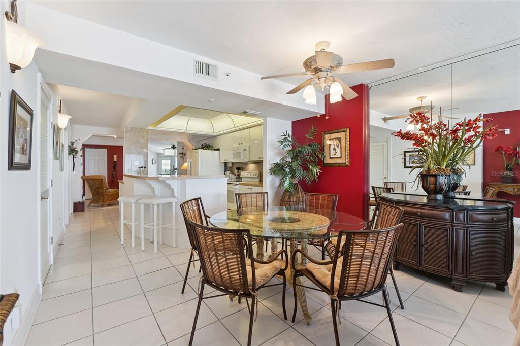4621 South Atlantic Avenue, Unit 7506 Ponce Inlet, FL 32127 - Photo 18 of 46 a view of a dining room with furniture and chandelier
