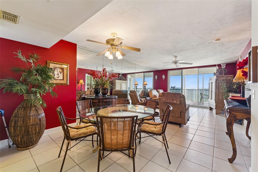 4621 South Atlantic Avenue, Unit 7506 Ponce Inlet, FL 32127 - Photo 19 of 46 a view of a dining room with furniture and chandelier