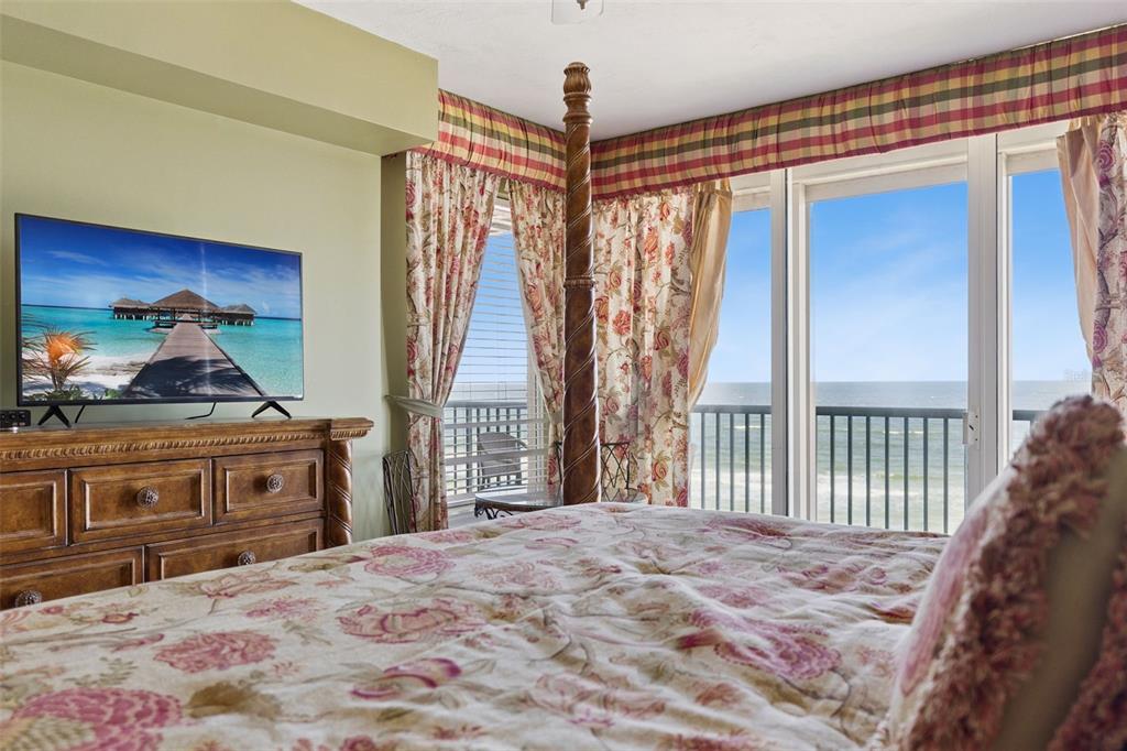 4621 South Atlantic Avenue, Unit 7506 Ponce Inlet, FL 32127 - Photo 23 of 46 a bedroom with a bed next to a window
