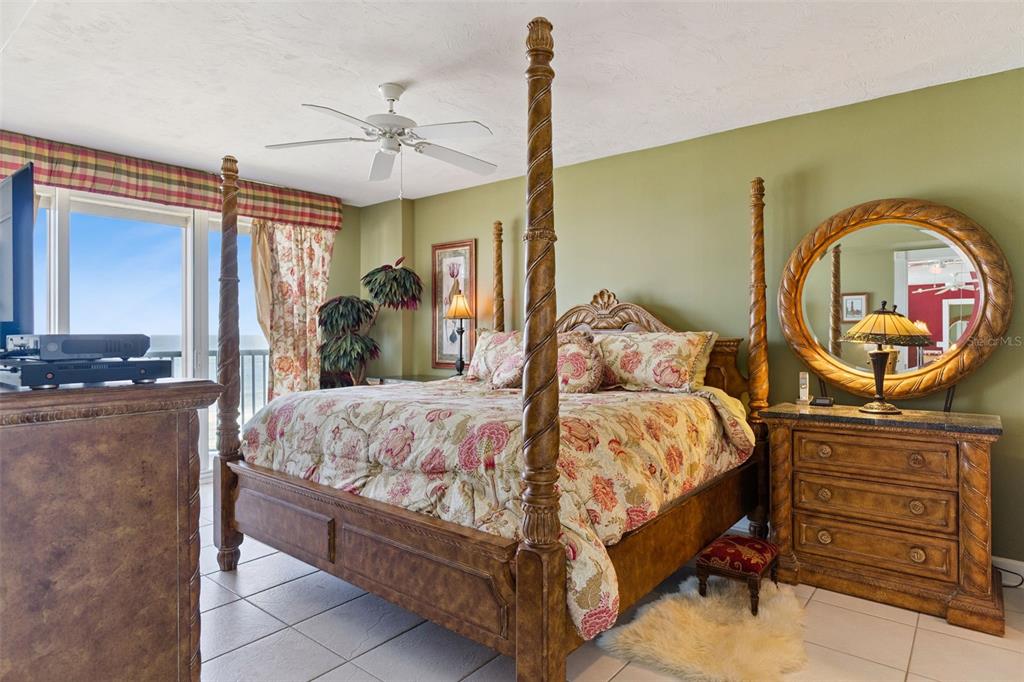 4621 South Atlantic Avenue, Unit 7506 Ponce Inlet, FL 32127 - Photo 24 of 46 a bed sitting in a bedroom next to a window