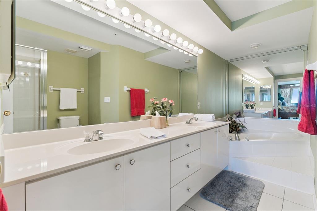 4621 South Atlantic Avenue, Unit 7506 Ponce Inlet, FL 32127 - Photo 28 of 46 a bathroom with a double vanity sink and a mirror