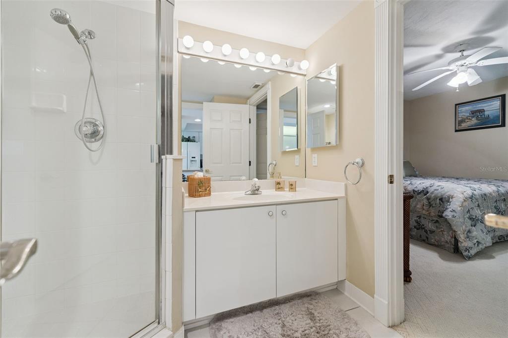 4621 South Atlantic Avenue, Unit 7506 Ponce Inlet, FL 32127 - Photo 32 of 46 a bathroom with a double vanity sink mirror and shower