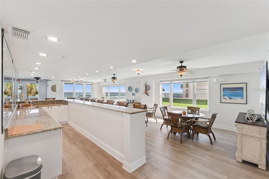4621 South Atlantic Avenue, Unit 7506 Ponce Inlet, FL 32127 - Photo 37 of 46 a kitchen with a table and chairs