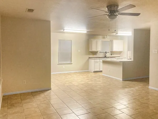 a view of a kitchen with a sink and cabinets