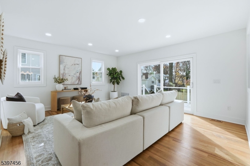 8 Mountainview Road Millburn, NJ 07041 - Photo 12 of 46 a living room with furniture and a large window