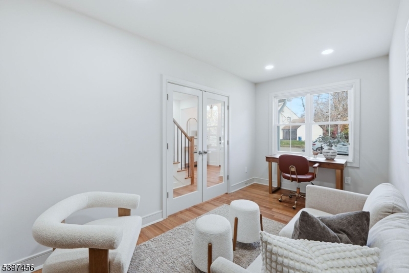 8 Mountainview Road Millburn, NJ 07041 - Photo 16 of 46 a living room with furniture and a large window
