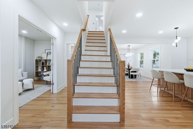 8 Mountainview Road Millburn, NJ 07041 - Photo 18 of 46 a view of entryway and hall with wooden floor