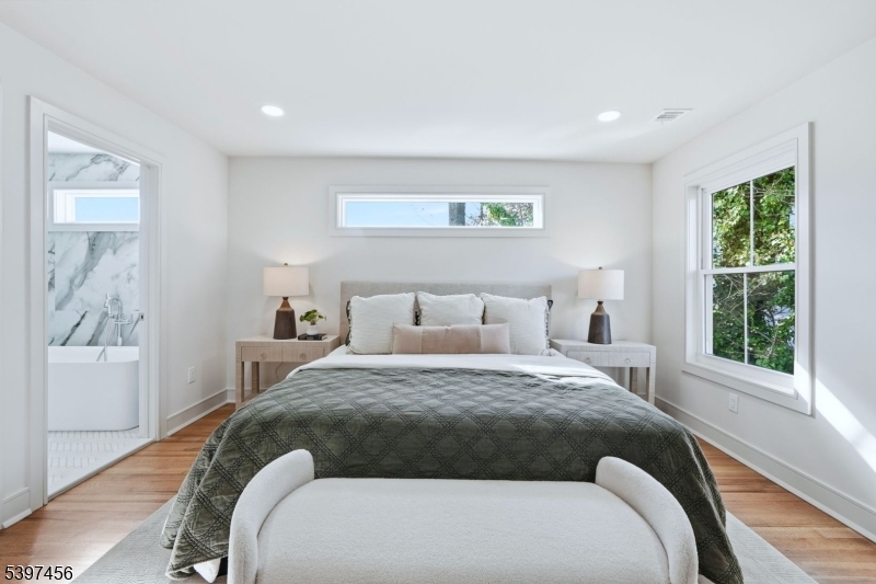 8 Mountainview Road Millburn, NJ 07041 - Photo 20 of 46 a bedroom with a large bed and a window