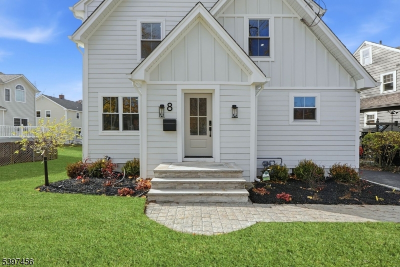 8 Mountainview Road Millburn, NJ 07041 - Photo 2 of 46 a view of a house with a yard and a garden
