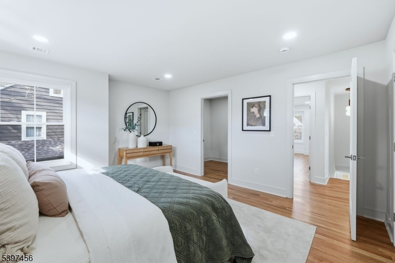 8 Mountainview Road Millburn, NJ 07041 - Photo 21 of 46 a bedroom with a large bed and a dresser