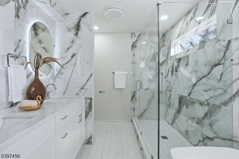 8 Mountainview Road Millburn, NJ 07041 - Photo 23 of 46 a bathroom with a sink and mirror