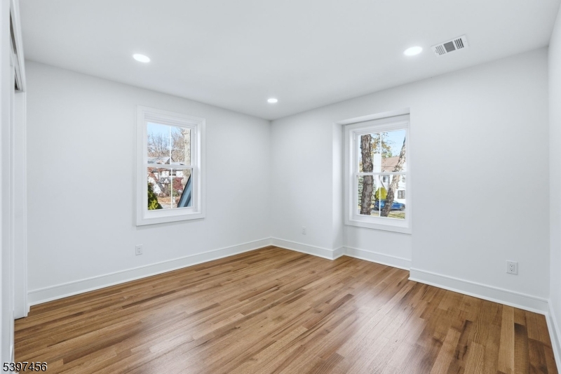 8 Mountainview Road Millburn, NJ 07041 - Photo 26 of 46 a view of empty room with wooden floor and fan