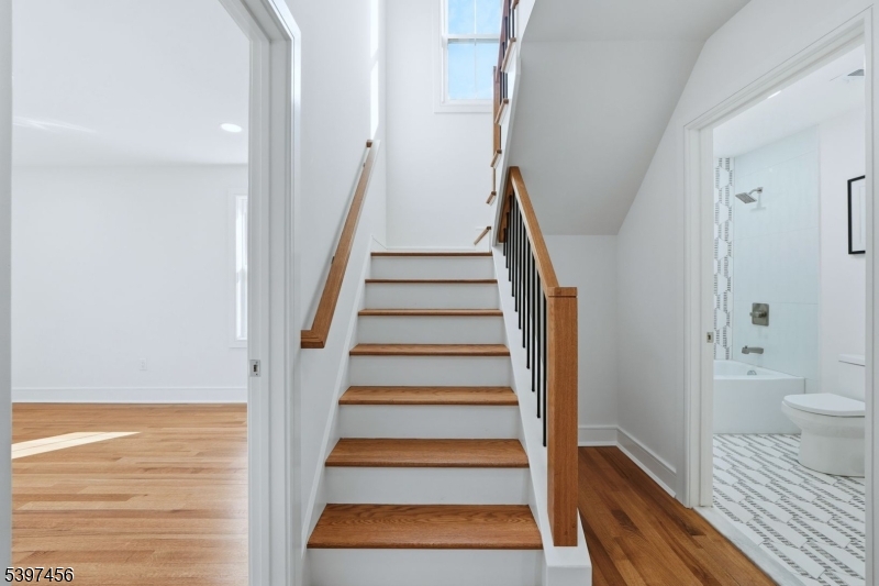 8 Mountainview Road Millburn, NJ 07041 - Photo 29 of 46 a view of a hallway with wooden floor and entryway