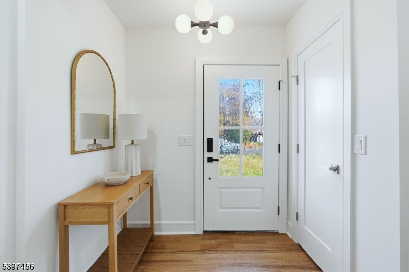 8 Mountainview Road Millburn, NJ 07041 - Photo 3 of 46 a view of an entryway with wooden floor