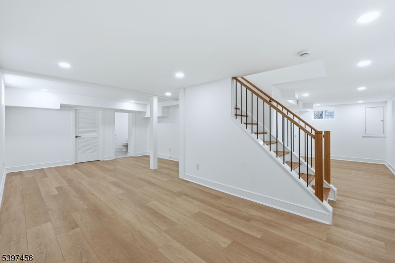 8 Mountainview Road Millburn, NJ 07041 - Photo 34 of 46 a view of an empty room with wooden floor