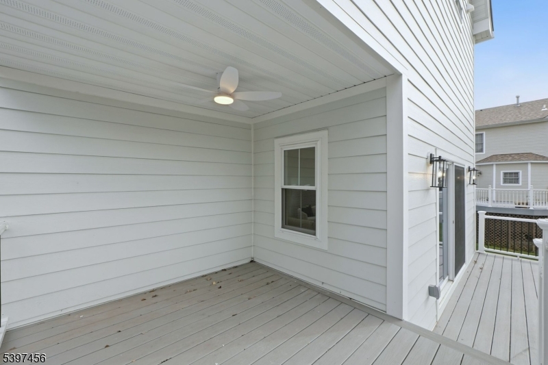 8 Mountainview Road Millburn, NJ 07041 - Photo 41 of 46 an empty room with wooden floor and windows
