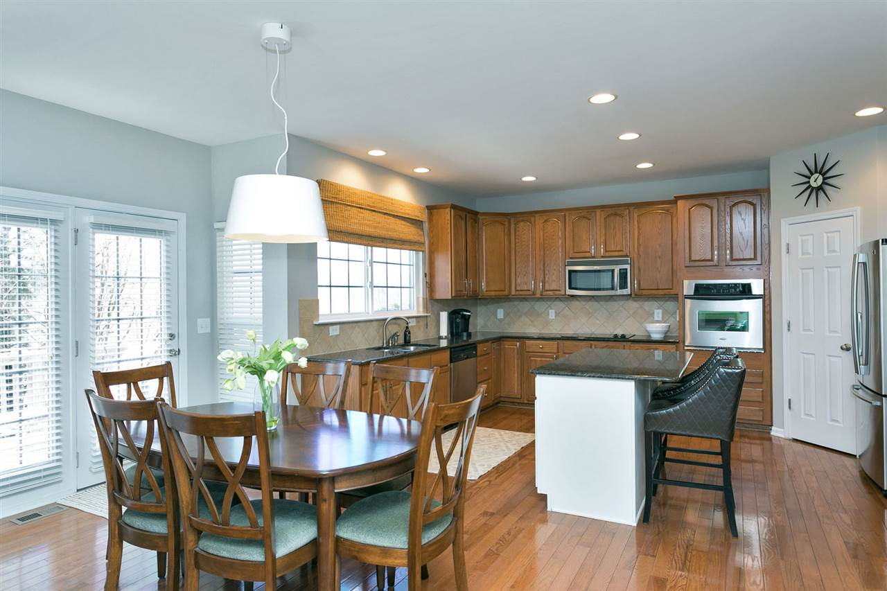 833 Seastone Street Raleigh, NC 27603 - Photo 4 of 21 Kitchen open to the family room with GRANITE and SS Appliances Kitchen