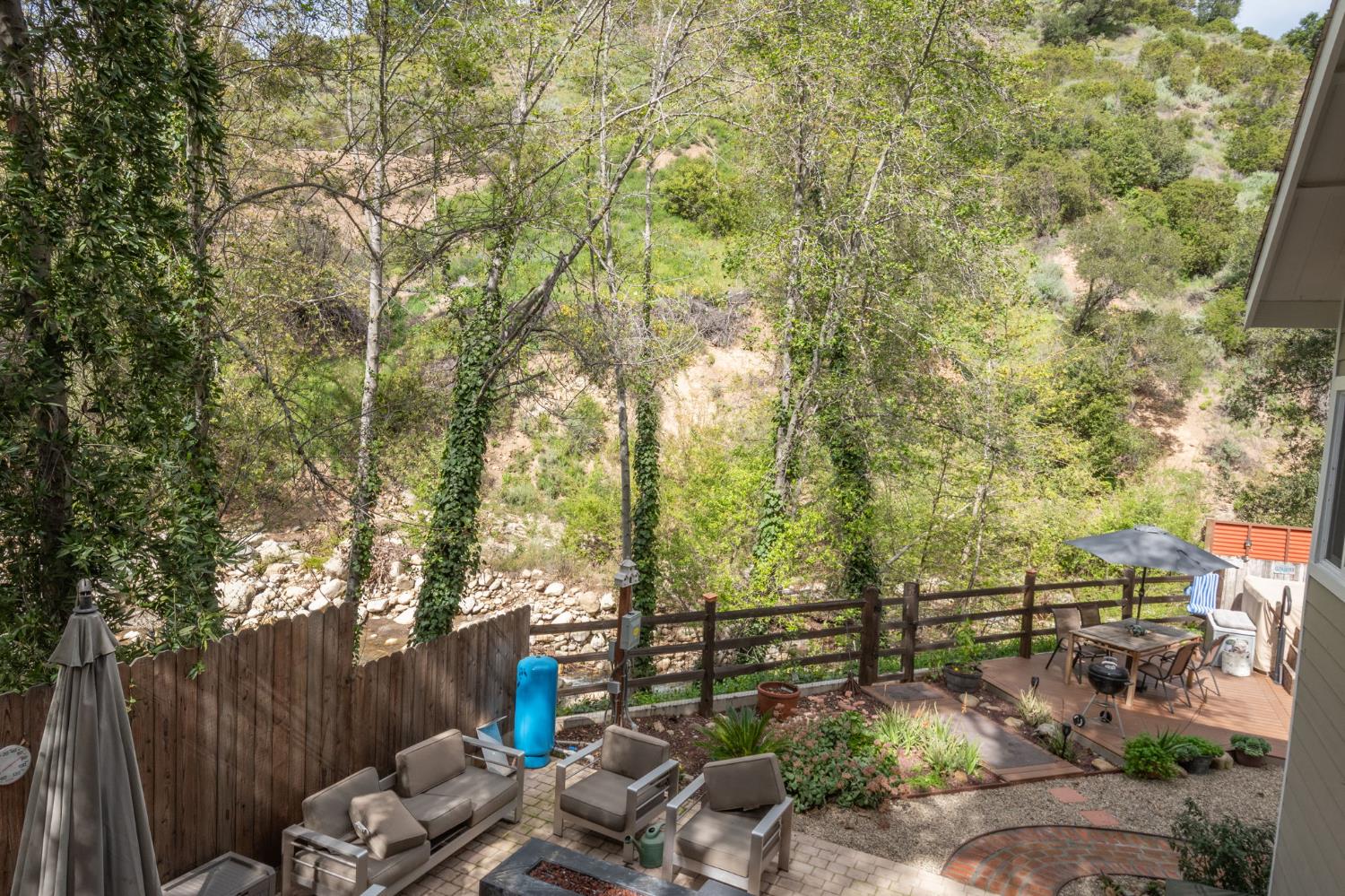 15663 Ojai Road Santa Paula, CA 93060 - Photo 20 of 47 a view of backyard with seating space and trees