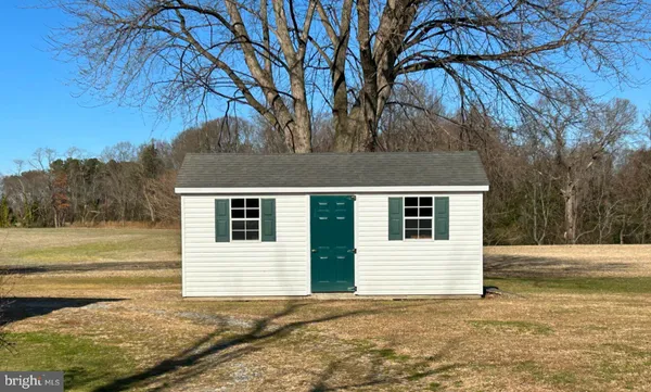 a house that has a tree in front of it