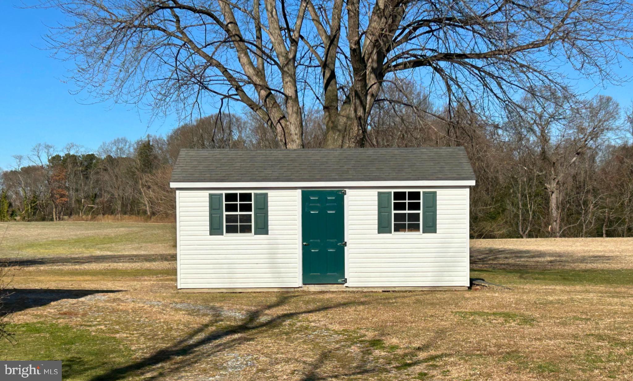 383 Lake Road Lottsburg, VA 22511 - Photo 15 of 18 a house that has a tree in front of it