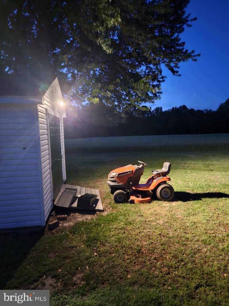 383 Lake Road Lottsburg, VA 22511 - Photo 17 of 18 a view of a lake in the backyard of house with outdoor seating