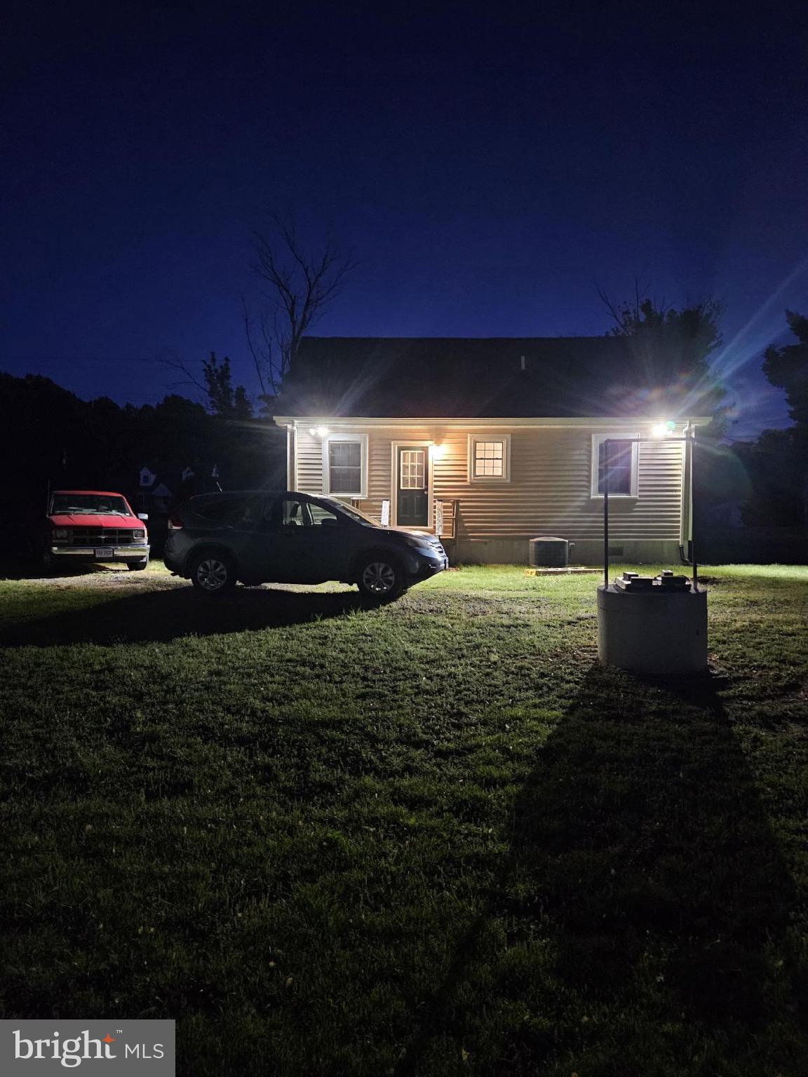 383 Lake Road Lottsburg, VA 22511 - Photo 18 of 18 a view of a house with a yard