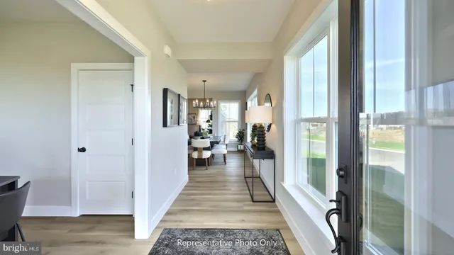 a view of a hallway with living room and furniture