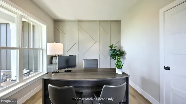 a view of a workspace with furniture