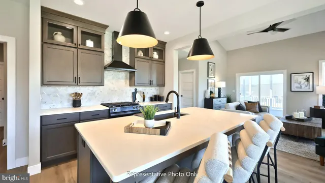 a kitchen with a dining table and chairs