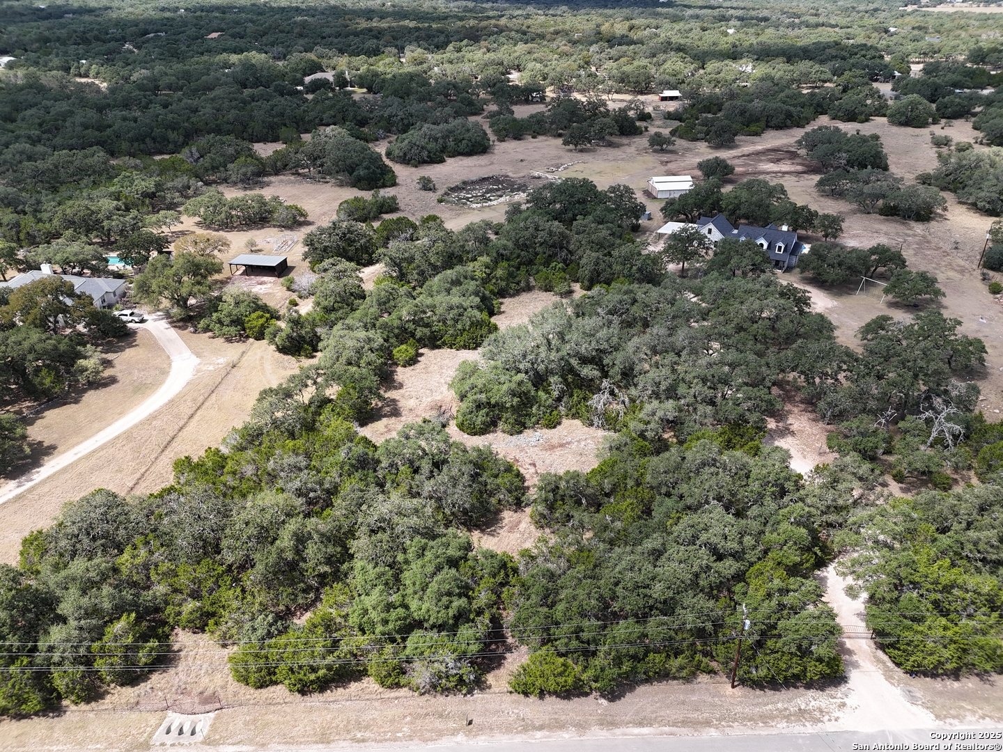 2110 Phantom Rider Trail Spring Branch, TX 78070 - Photo 1 of 11 a view of a forest with a street