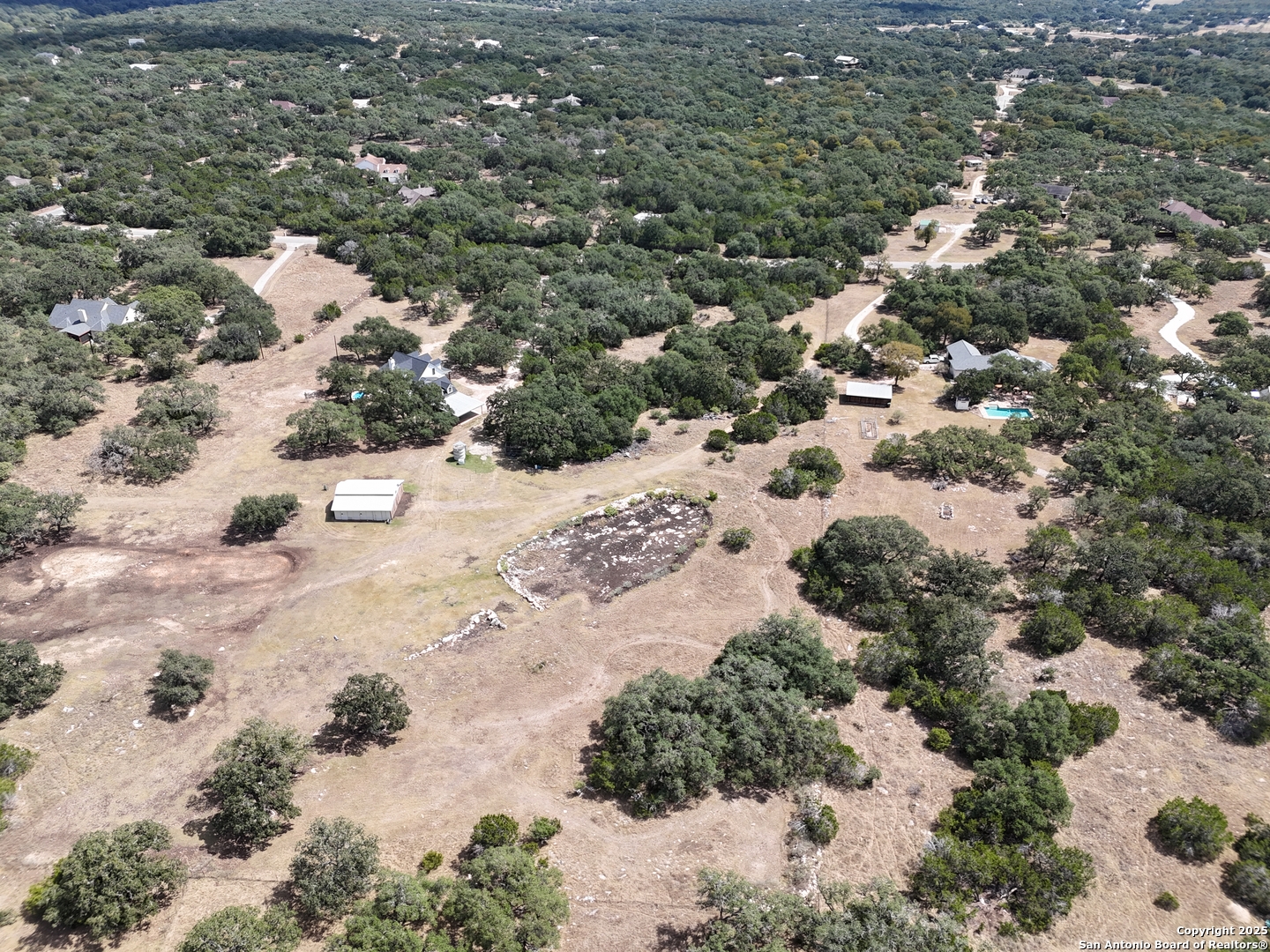2110 Phantom Rider Trail Spring Branch, TX 78070 - Photo 2 of 11 a view of a dry yard covered with snow