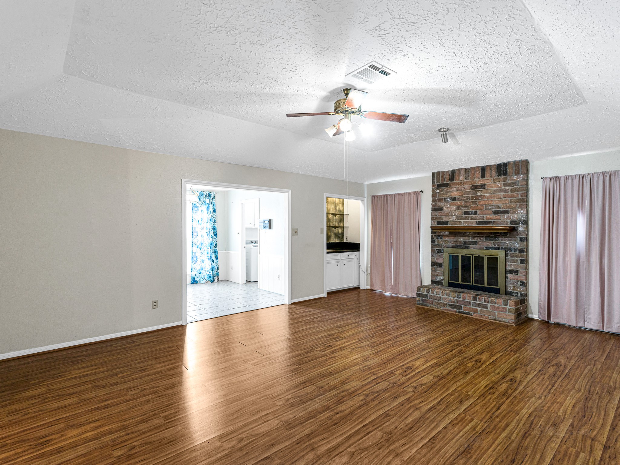 22906 Squirrel Tree Street Spring, TX 77389 - Photo 16 of 41 a view of an empty room with a window and wooden floor