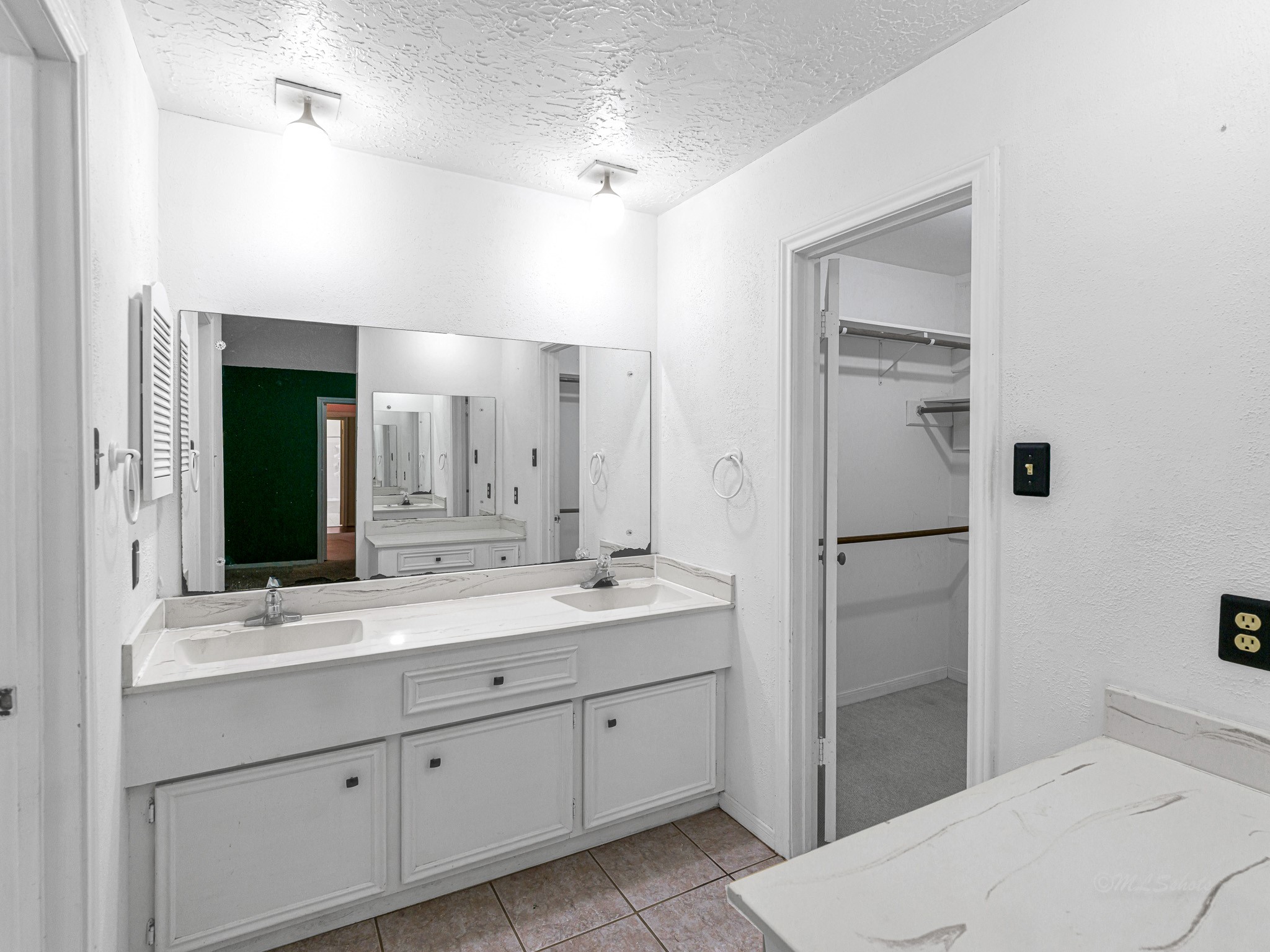 22906 Squirrel Tree Street Spring, TX 77389 - Photo 21 of 41 a spacious bathroom with a double vanity sink mirror and double