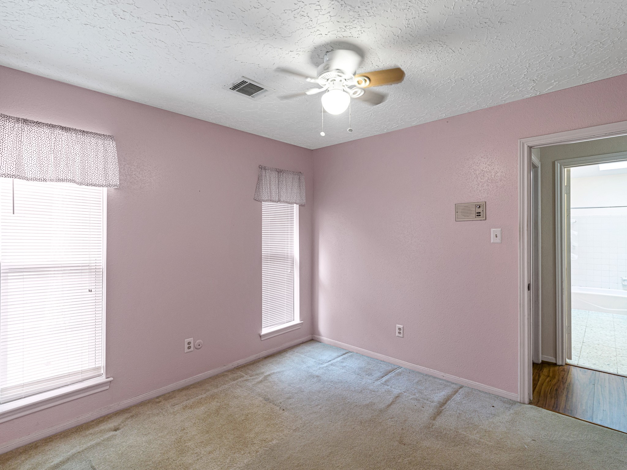 22906 Squirrel Tree Street Spring, TX 77389 - Photo 24 of 41 an empty room with windows and chandelier fan