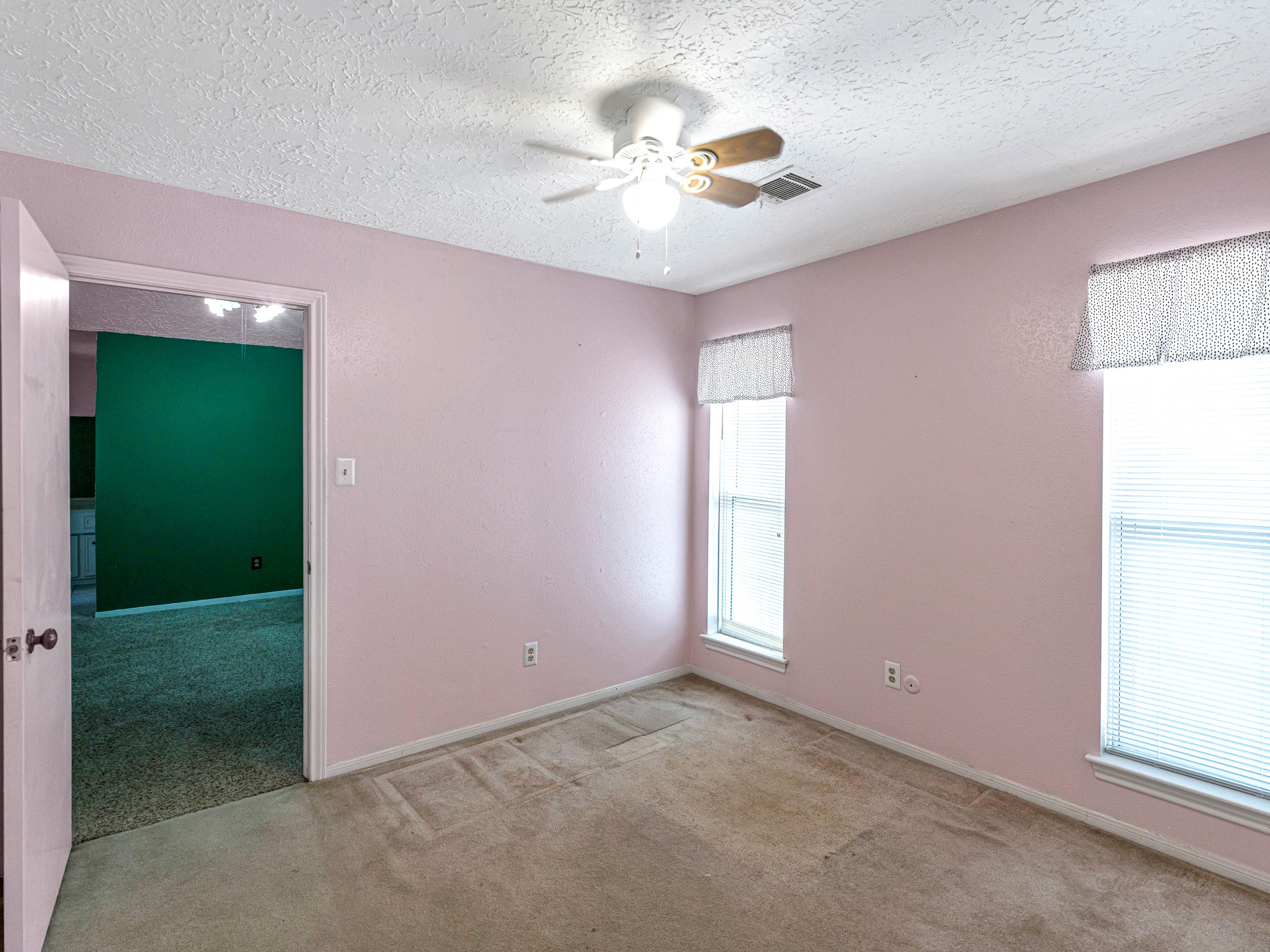 22906 Squirrel Tree Street Spring, TX 77389 - Photo 25 of 41 an empty room with windows and fan