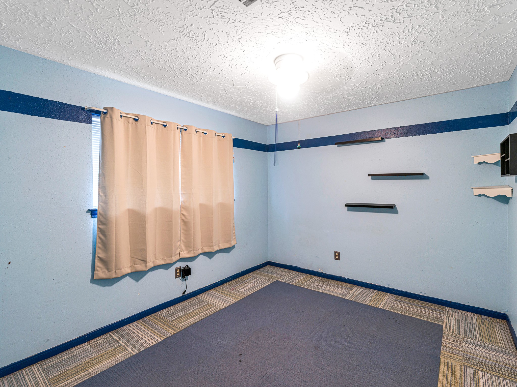 22906 Squirrel Tree Street Spring, TX 77389 - Photo 26 of 41 a room with a window and a wooden floor