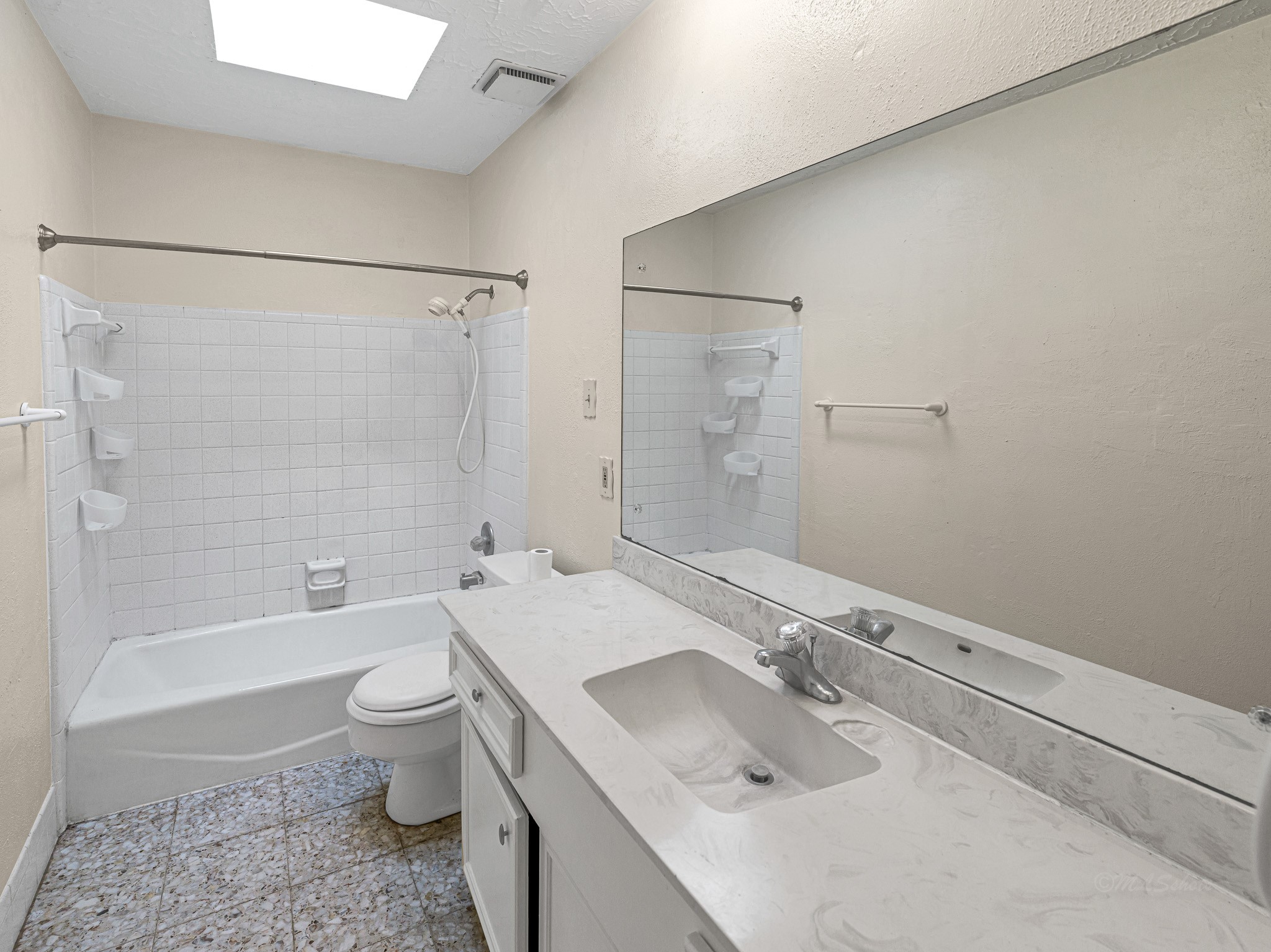 22906 Squirrel Tree Street Spring, TX 77389 - Photo 27 of 41 a bathroom with a granite countertop sink a toilet and shower