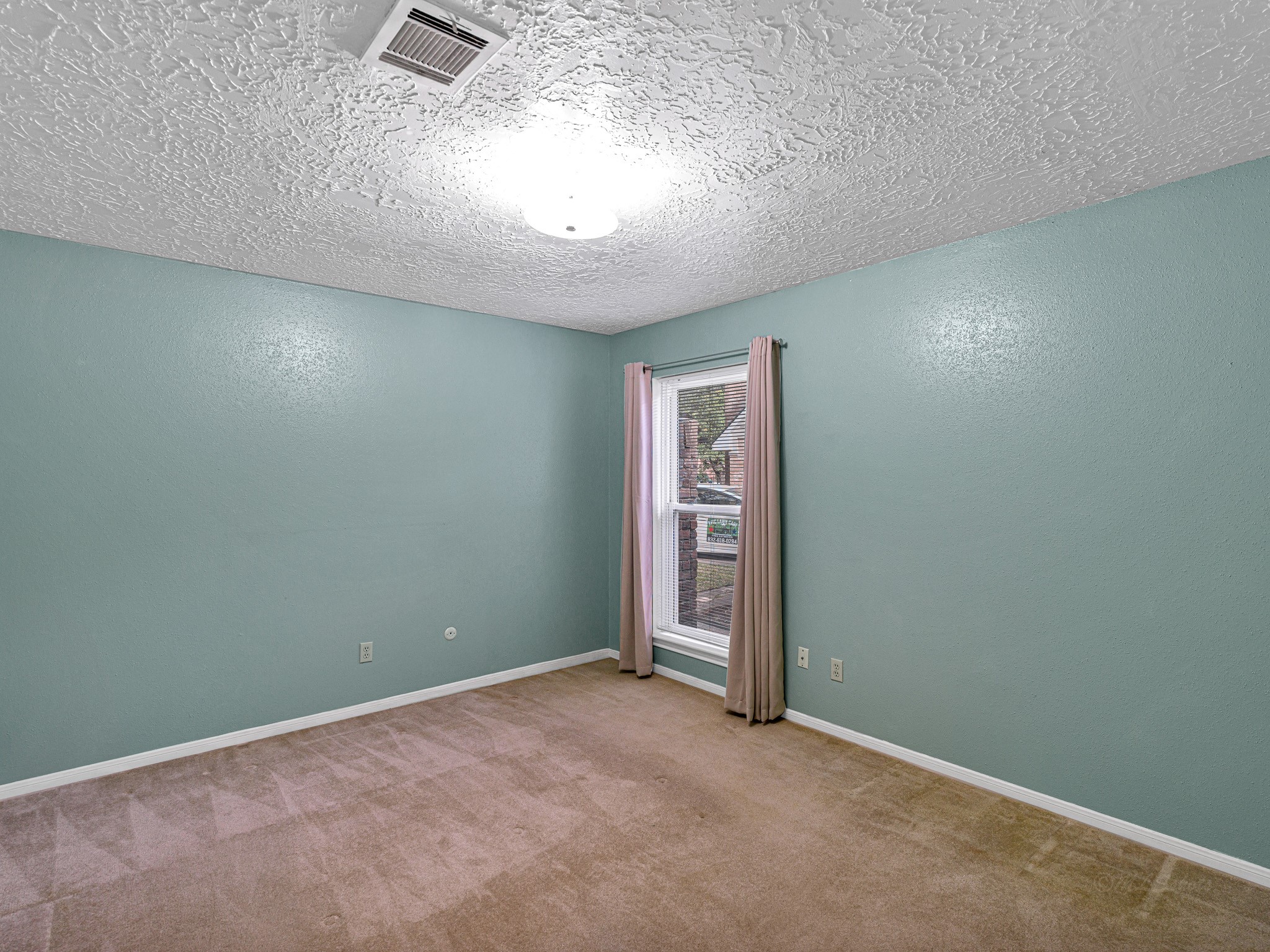 22906 Squirrel Tree Street Spring, TX 77389 - Photo 28 of 41 an empty room with windows