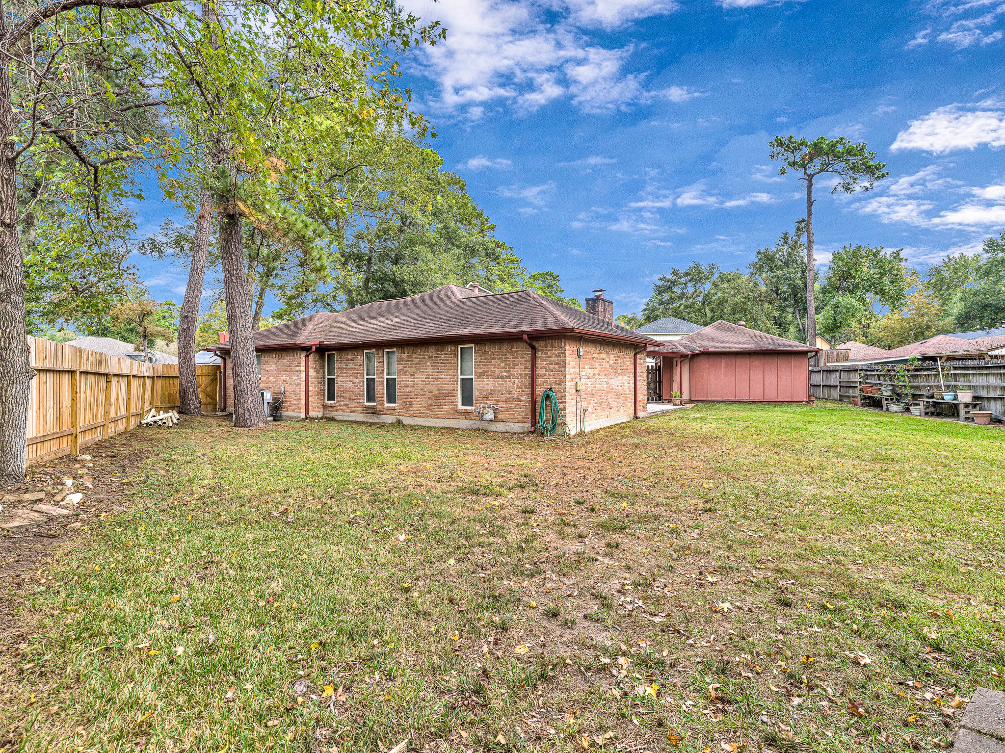 22906 Squirrel Tree Street Spring, TX 77389 - Photo 32 of 41 a front view of a house with a garden
