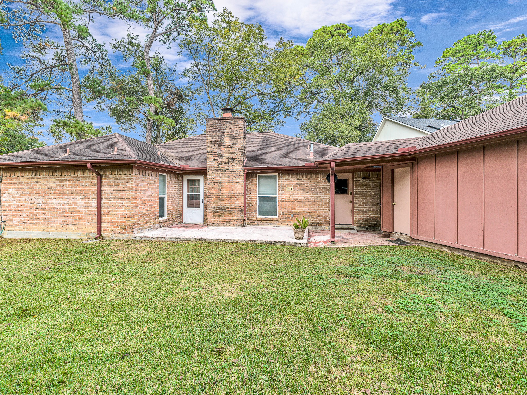 22906 Squirrel Tree Street Spring, TX 77389 - Photo 33 of 41 a front view of a house with a garden and porch