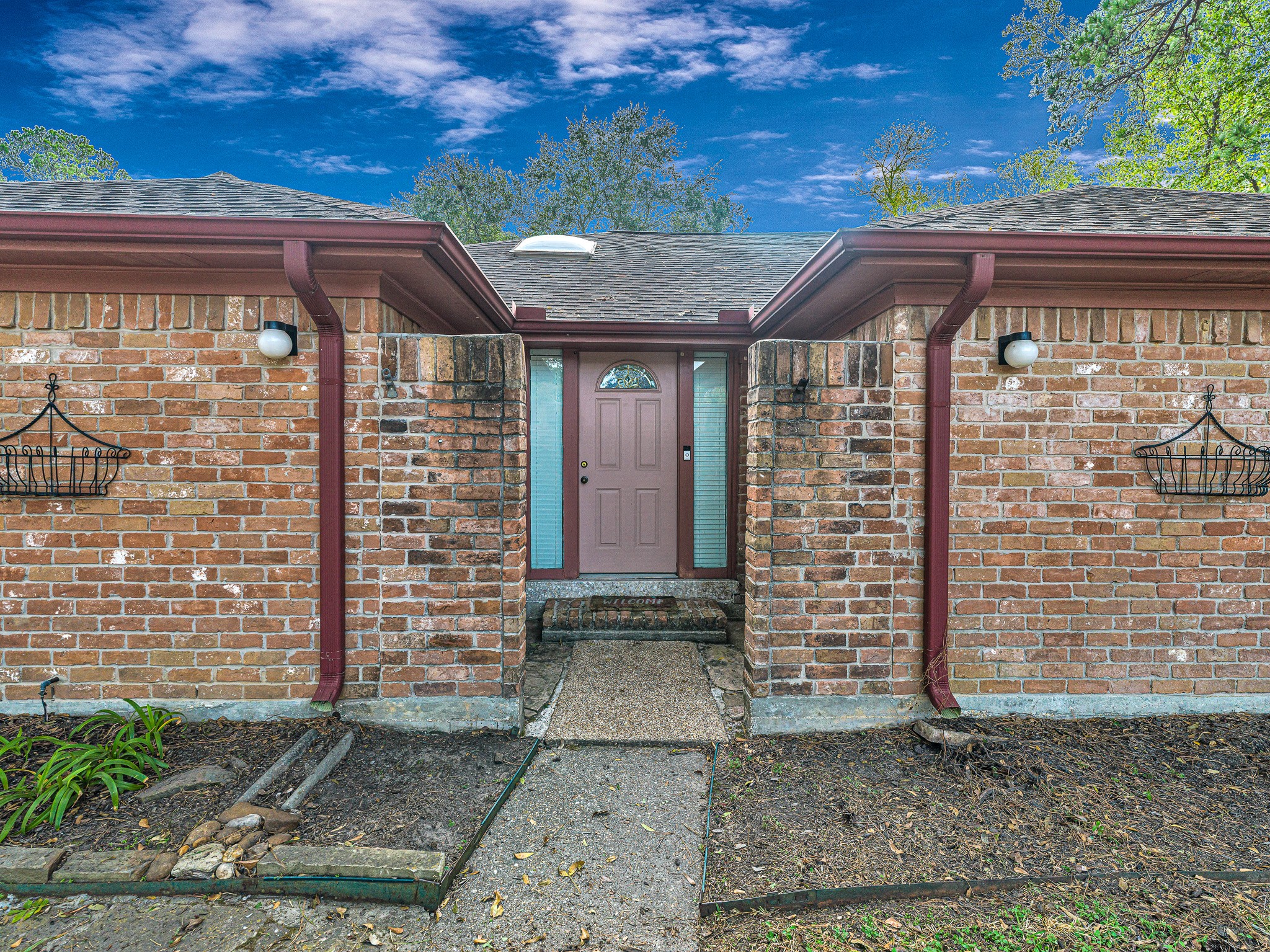 22906 Squirrel Tree Street Spring, TX 77389 - Photo 4 of 41 a front view of a house with a garage