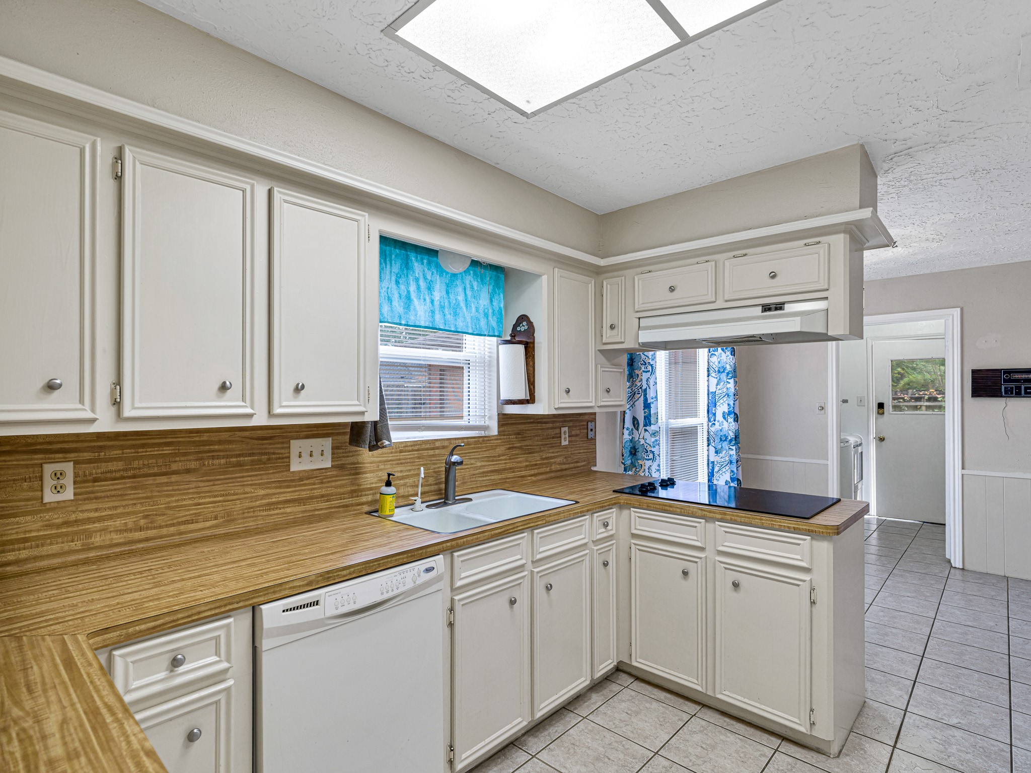 22906 Squirrel Tree Street Spring, TX 77389 - Photo 8 of 41 a kitchen with granite countertop a sink stainless steel appliances and cabinets