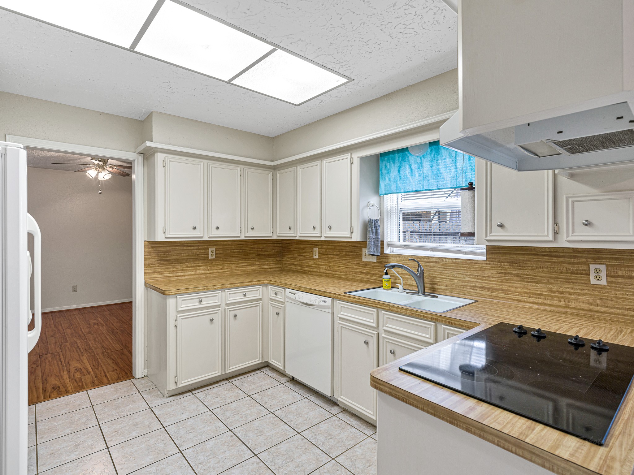 22906 Squirrel Tree Street Spring, TX 77389 - Photo 9 of 41 a kitchen with a sink cabinets and window